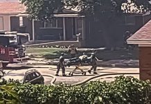 Roy City Fire seeks photos, video related to July 20 fire Firefighters and bystanders push a stretcher along a suburban street with a fire truck nearby.