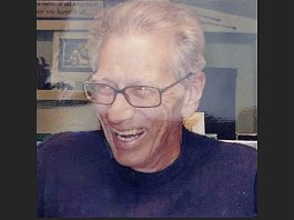 Search underway in Grand Canyon for missing 83-year-old hiker from Kanab Older man with glasses smiling and laughing, in a dark shirt.